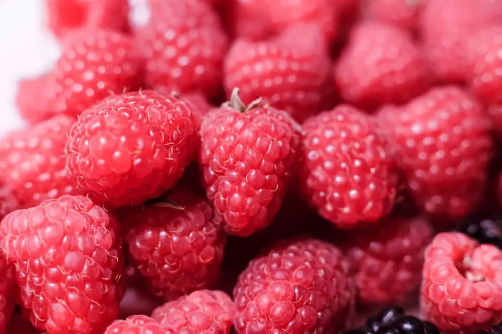 A close-up image of fresh raspberries.