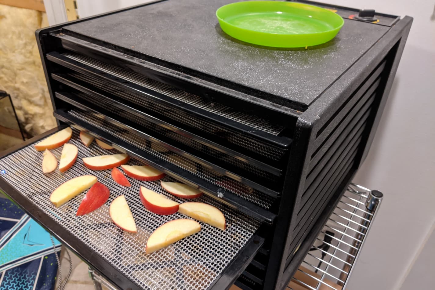 an image of our Excalibur dehydrator running apples