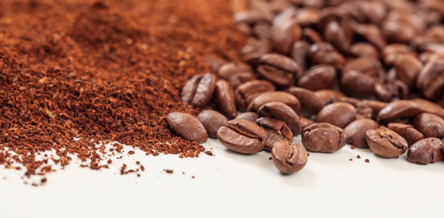 An image of Coffee beans and ground coffee.