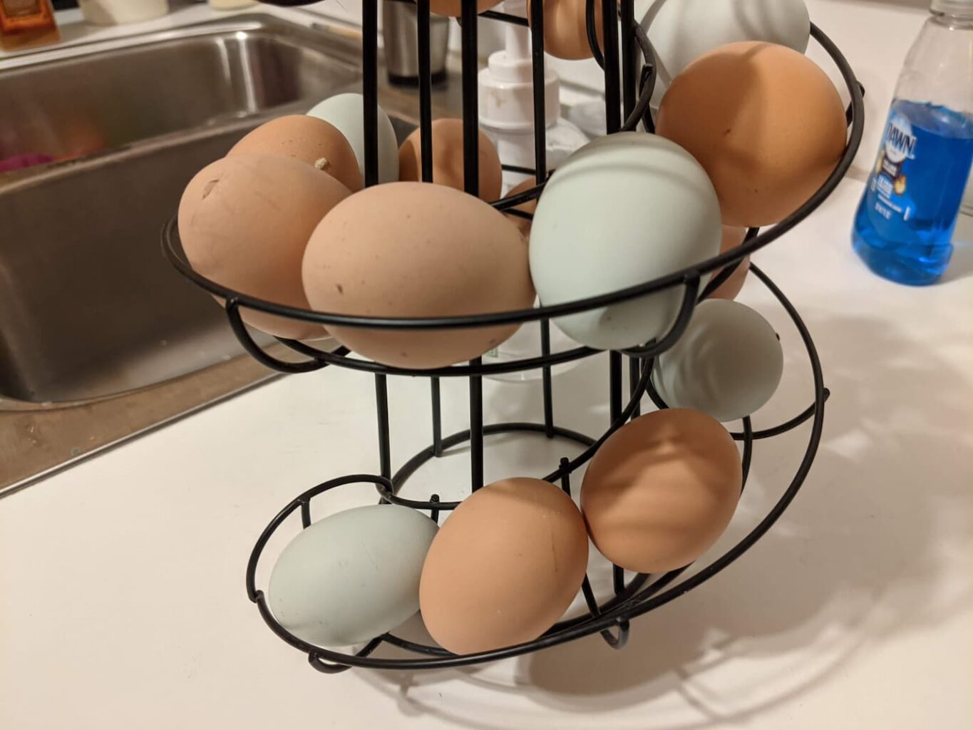 An image of fresh eggs lined up spirally in my kitchen counter egg station.