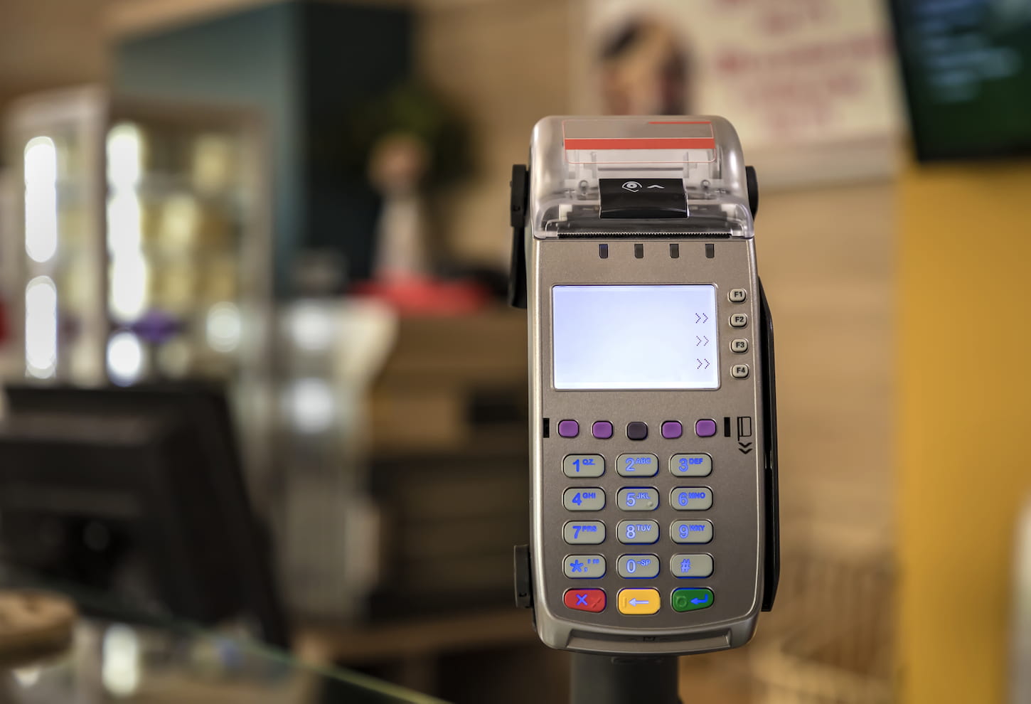 An image of a card payment terminal POS terminal at a shop.