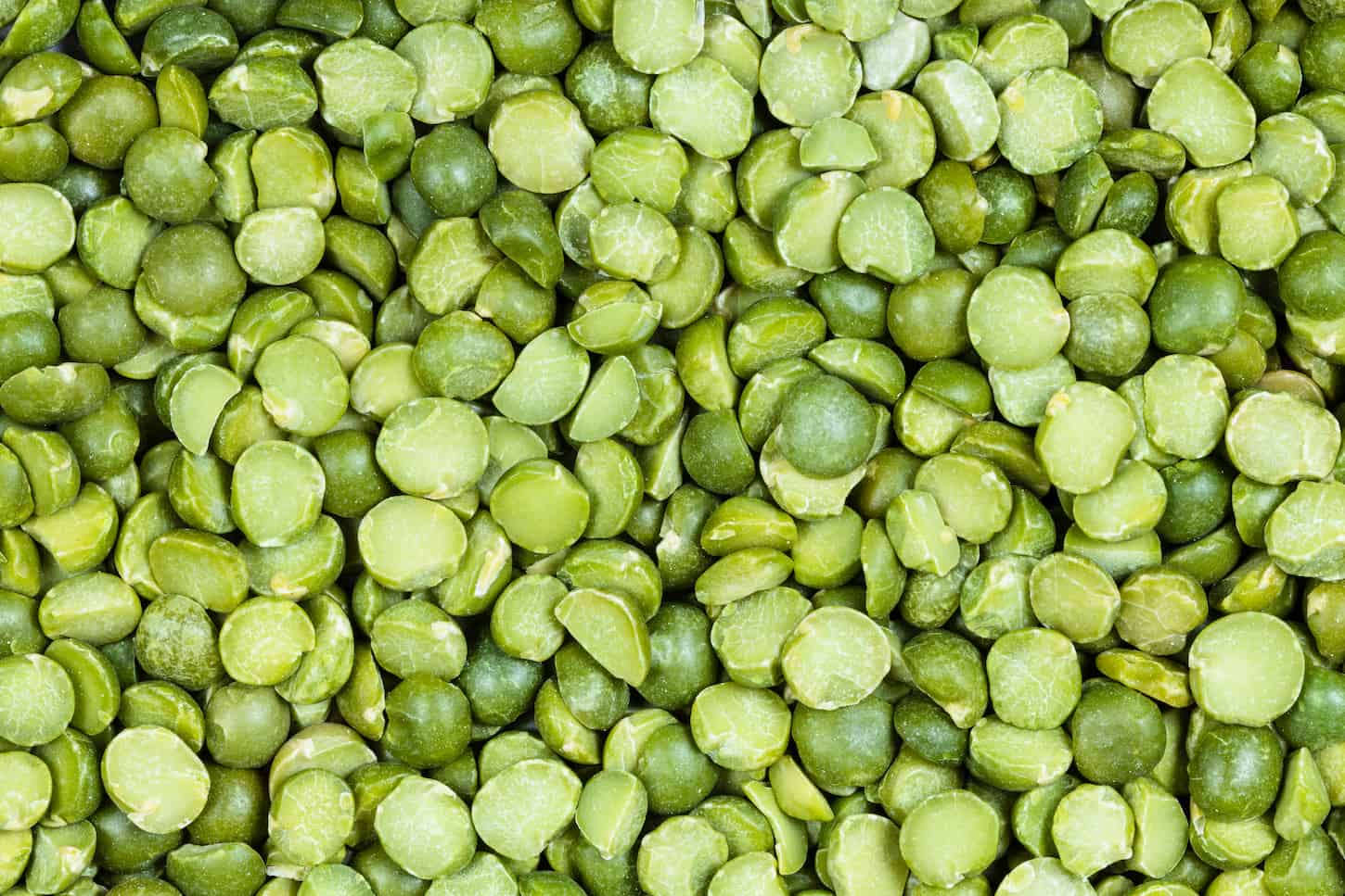 An image of raw dried green split peas.