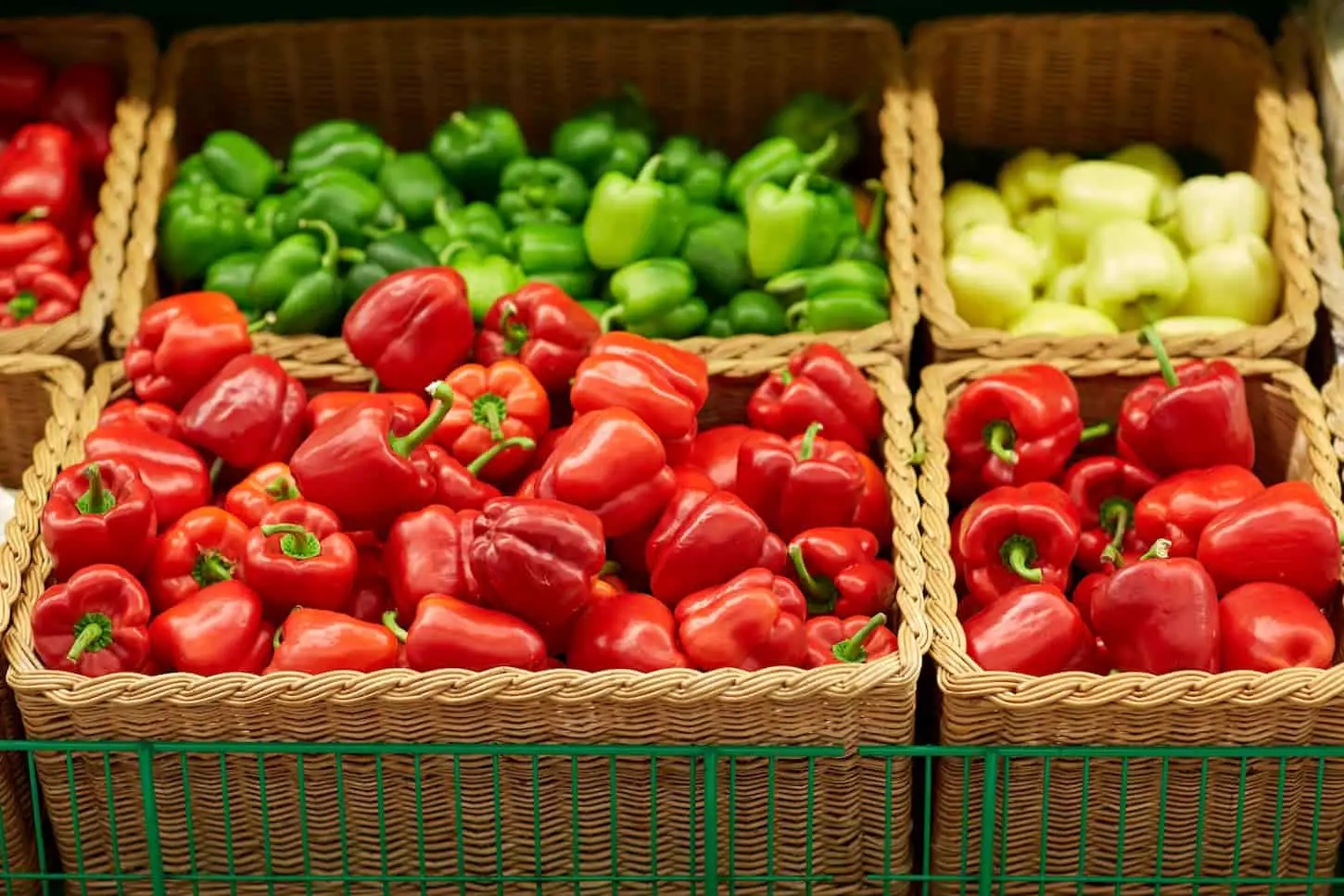 An image of bell peppers or paprika at a grocery store or market.