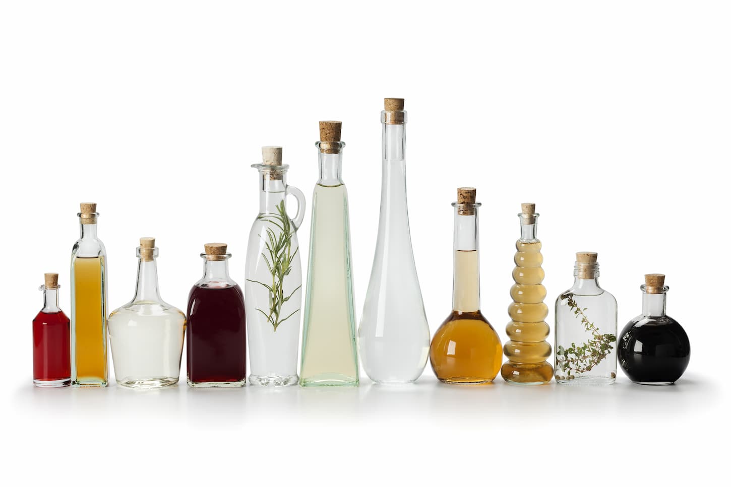 An image of Row of bottles with vinegar.